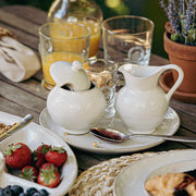 Juliska Puro Classic Whitewash Creamer, 9 oz. on table