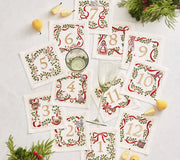 Xmas Carol Cocktail Napkin in White, Red & Green, Set of 12 in Gift Box by Kim Seybert