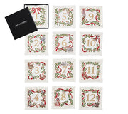 Xmas Carol Cocktail Napkin in White, Red & Green, Set of 12 in Gift Box by Kim Seybert